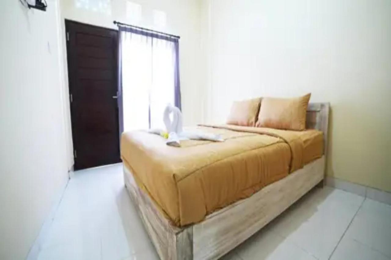 Oyo Flagship 91237 Ratu Guest House Kedunganan Eksteriør bilde